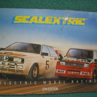 VINTAGE  SCALEXTRIC  CATALOGUE 27TH EDITION 1986 fair reference condition cover has a few marks and creases and spine starting to split below the bottom stappel