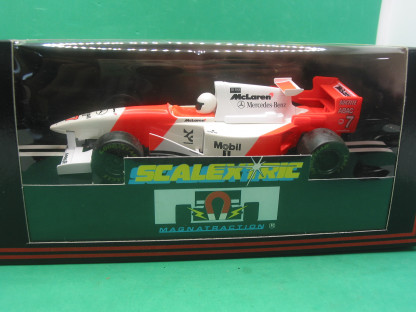 SCALEXTRIC C585  MCLAREN MERCEDES MP4/10 #7  (LACQUER HAS SOME SLIGHT DIS COLOUR IN PLACES) MINT BOXED IN ORIGINAL CRISP BLACK BOX WITH YELLOW END LABEL COLLECTORS CONDITION