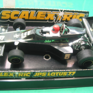 DELETED SCALEXTRIC C126 JPS LOTUS GOLD LINE DOES NOT CROSS THE COCKPIT  original price label on box and the sale price ticket reducing from £5.95 to  £2.95!  REPRO REAR TYERS SO RUNS WELL vg+b  #5 RED drivers helmet