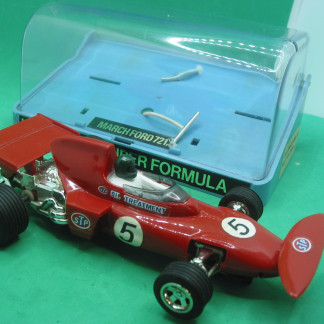 SCALEXTRIC C26 MARCH FORD 721 This is the First Version of this car RX motor - clear screen dark green helmet red aerofoil shiny chrome engine detail chrome wheels  in original box with intact hinges