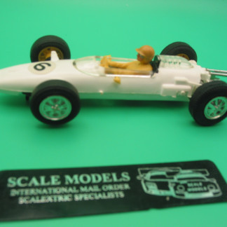 TRIANG SCALEXTRIC C81 COOPER FORMULA JUNIOR WHITE - DRIVER IS CAST IN YELLOW PLASTIC POSSIBLY A PROTO TYPE CAR - ALL THE C81 COOPERS NORMALLY HAVE DRIVERS CAST IN WHITE (RED CAR) AND BLUE (WHITE CAR) THE BEIGE DRIVERS HELMET IS ALSO UNIQUE TO THIS CAR . CAR APPEARS UNRUN GUIDE HAS NO SCRATCHES, NO MARKS ON THE WHITE BODY. LOVELY COLLECTORS ITEM