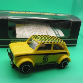 VINTAGE SCALEXTRIC C122  MINI 1275GT YELLOW TYPE 2 WITH TAMPO PRINTED STRIPES DATED 4TH JANUARY 1978 ORIGINAL BOX  (HAD NEW CELLOPHANE) WITH INSTRUCTIONS ORIGINAL SOLD BY WEBSTERS OF CHEADLE A MODEL SHOP I AS A CHILD STARE IN THE WINDOW OF.  EXCB